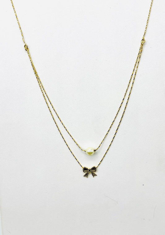 Double strand necklace with bow and gold pearl